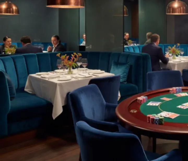 Smoked-glass poker tables and lounge seating in an obsidian copper card room
